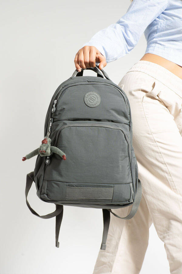 Unisex waterproof backpack with 3 compartments and a laptop pocket. - 1