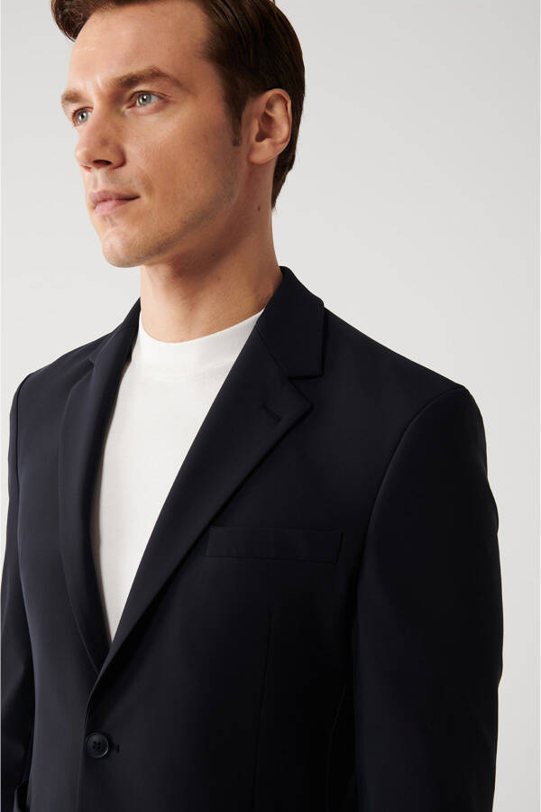 Water-resistant, 360 degree stretch, slim fit, single button, double vent, unlined navy blue men's jacket. - 7