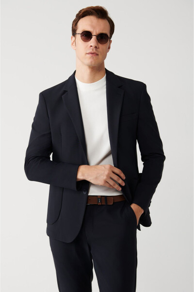 Water-resistant, 360 degree stretch, slim fit, single button, double vent, unlined navy blue men's jacket. - 8