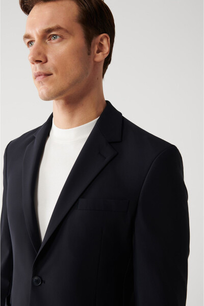 Water-resistant, 360 degree stretch, slim fit, single button, double vent, unlined navy blue men's jacket. - 2