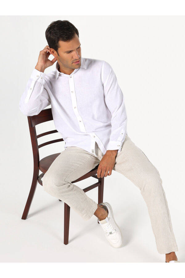 White, long-sleeved, regular fit men's shirt. - 1