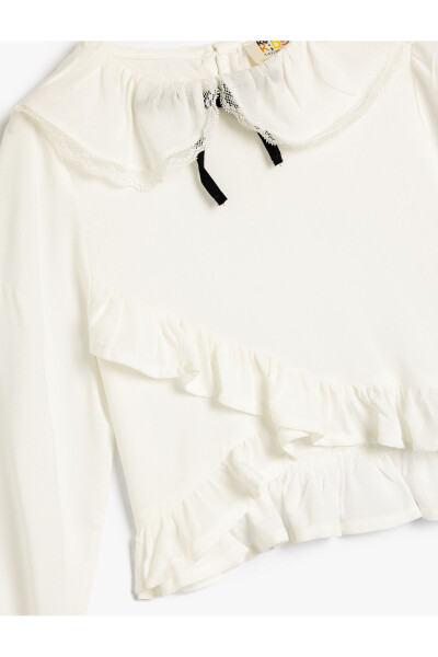 Wide blouse with a baby collar, long sleeves, frilled cuffs and elastic. - 6