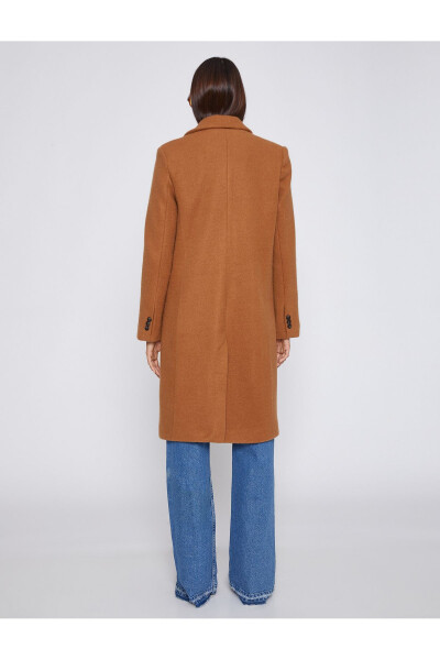 Wide collar coat with button details and pockets. - 4