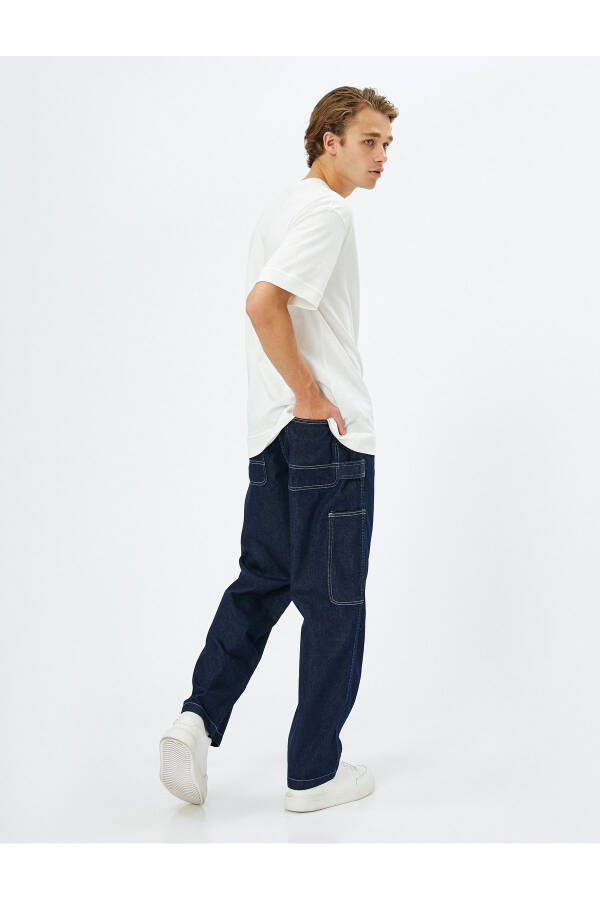 Wide leg cargo pants with button details. - 2