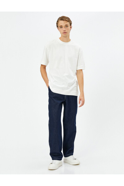 Wide leg cargo pants with button details. - 3