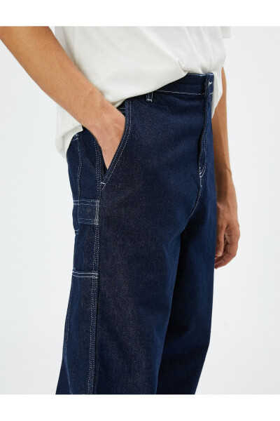 Wide leg cargo pants with button details. - 6