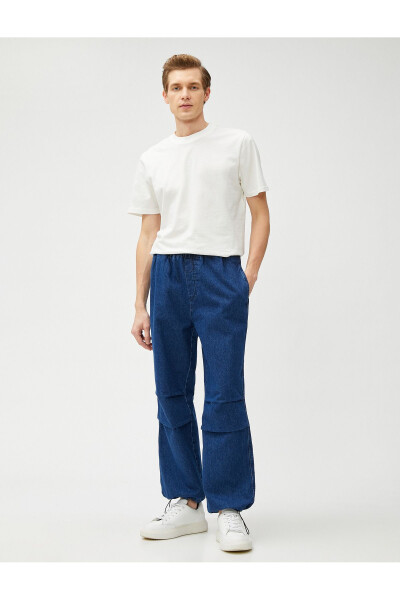 Wide leg, pocket detailed, cotton parachute pants with drawstring waist and hem. - 2