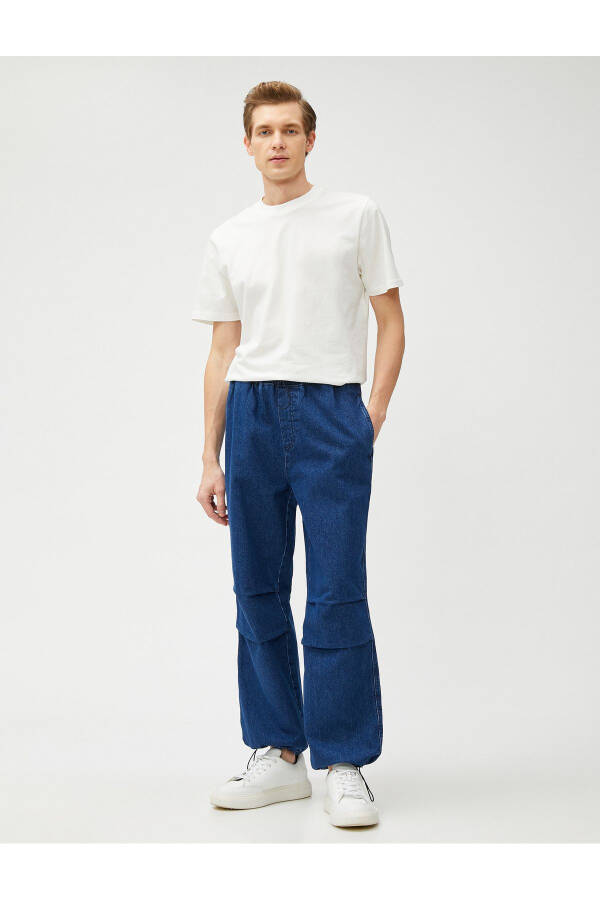 Wide leg, pocket detailed, cotton parachute pants with drawstring waist and hem. - 2