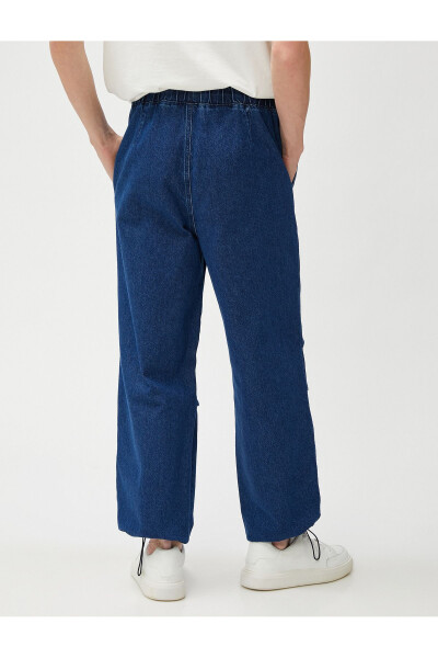 Wide leg, pocket detailed, cotton parachute pants with drawstring waist and hem. - 4