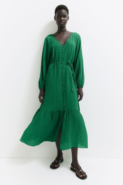 Woman in a green crepe dress with a green belt - 2