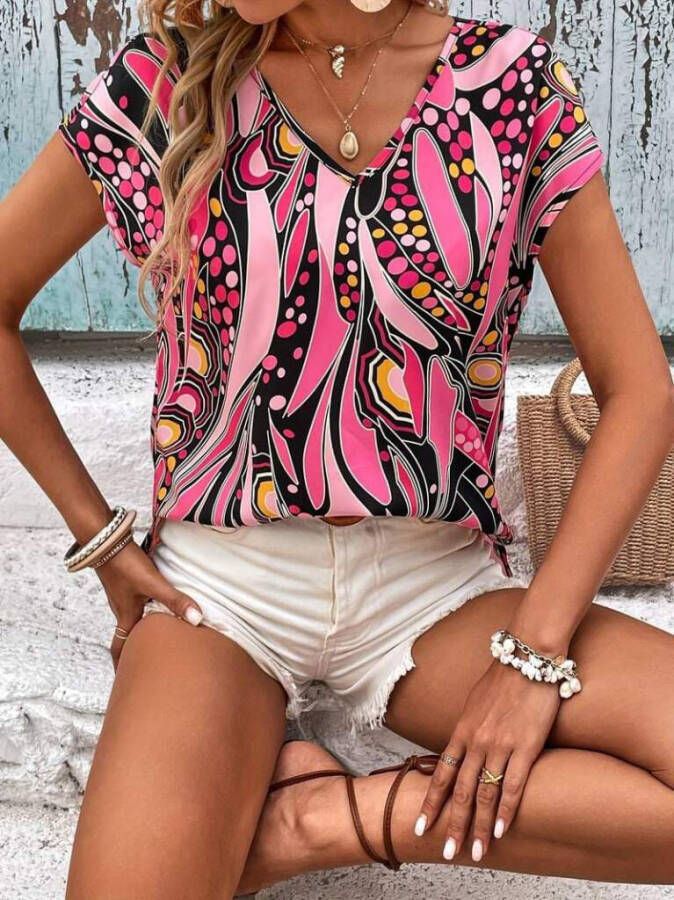 Women's short-sleeved blouse with pink pattern, V-neck, batwing sleeves, short front and long back. - 4