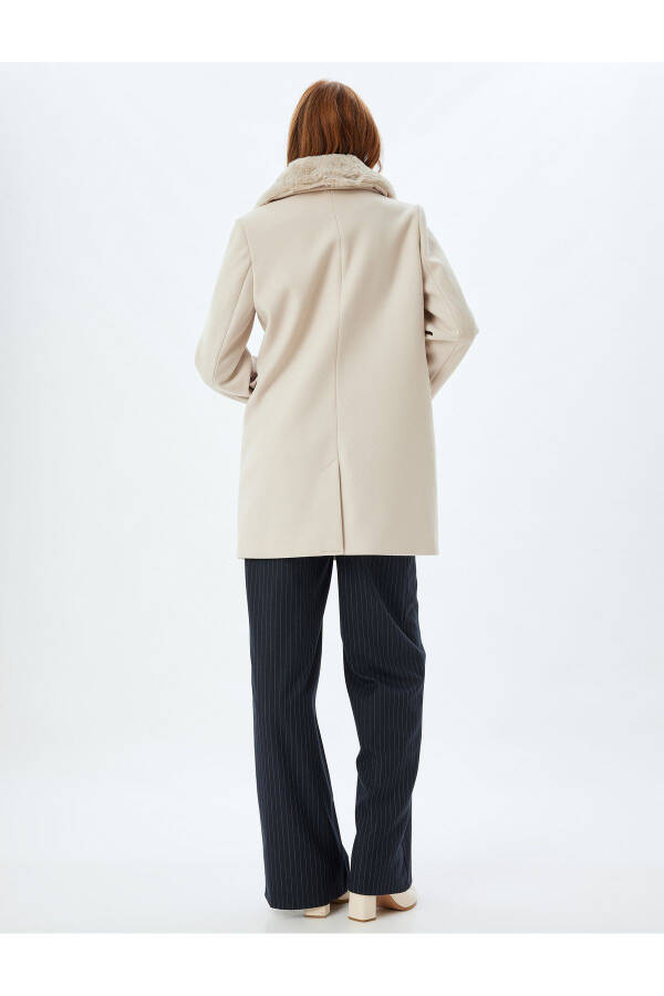 Wool coat with detachable faux fur collar, pockets and buttons. - 9